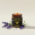 Lavender balm with natural bright yellow text and orange balm